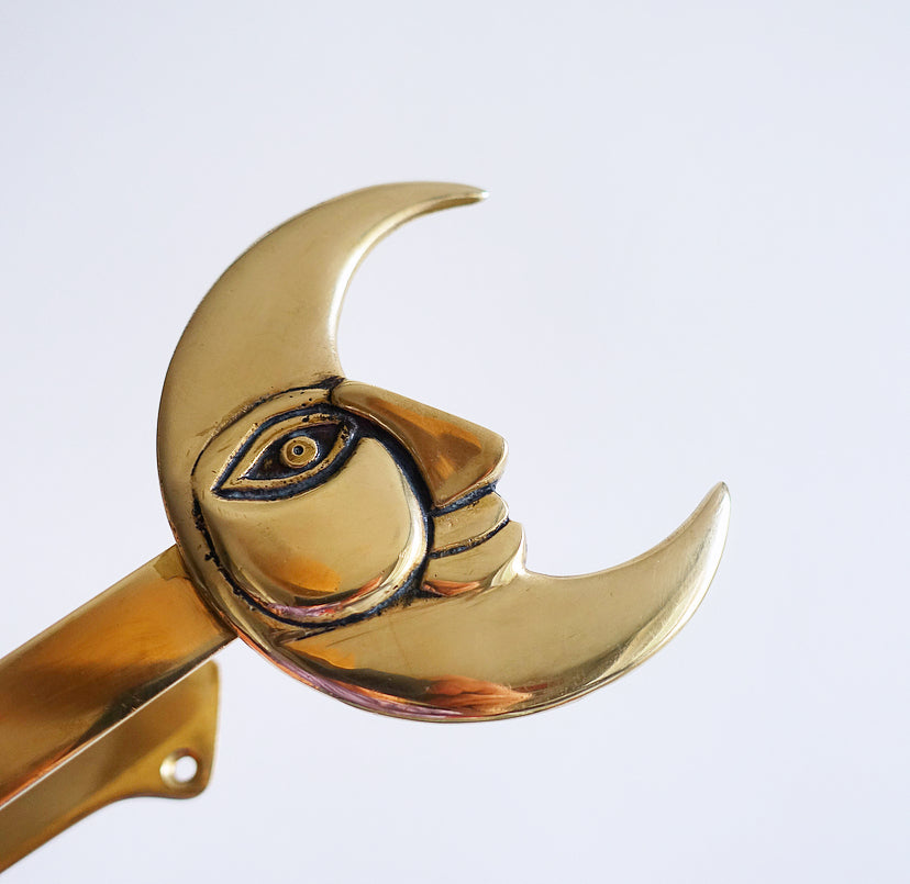 Pair of brass moon curtain tie-backs