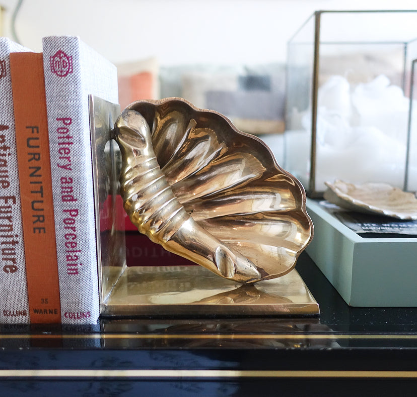 Pair of brass shell bookends