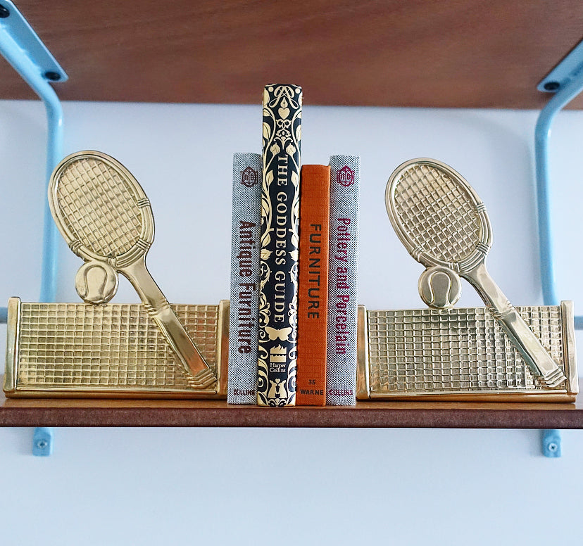 Pair of brass tennis racket, ball & net bookends