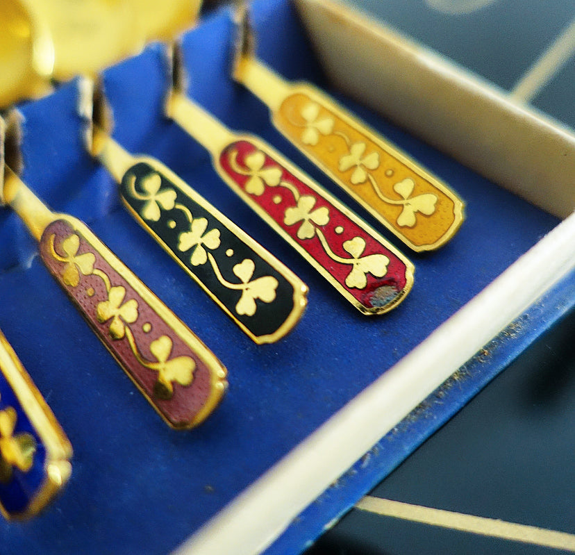 Set of six Danish gold plated and rainbow enamel lucky charm spoons