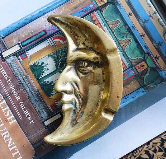 Brass man in the moon ashtray