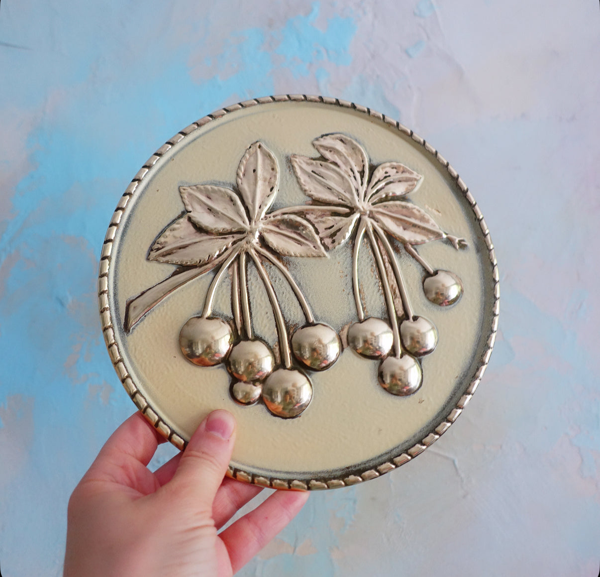 Set of four brass fruit wall plaques