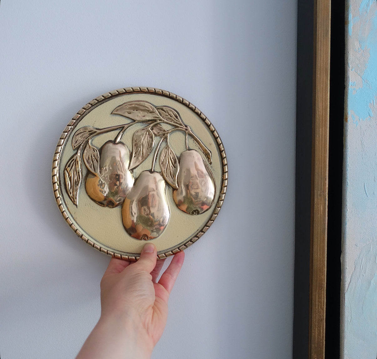 Set of four brass fruit wall plaques