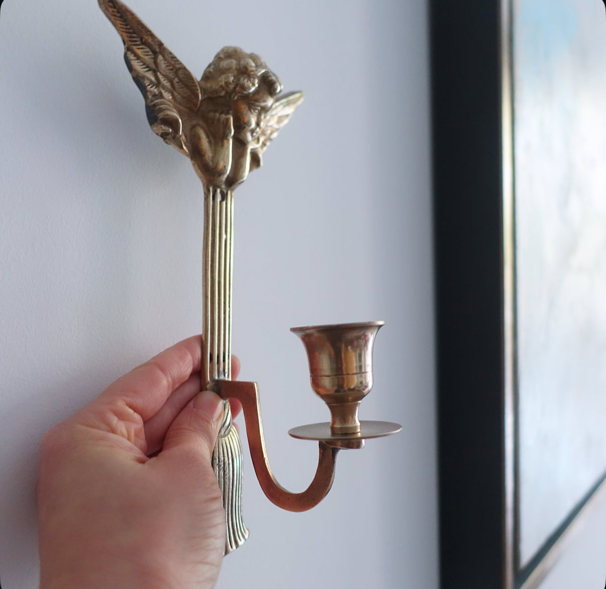 Brass cherub candle sconces