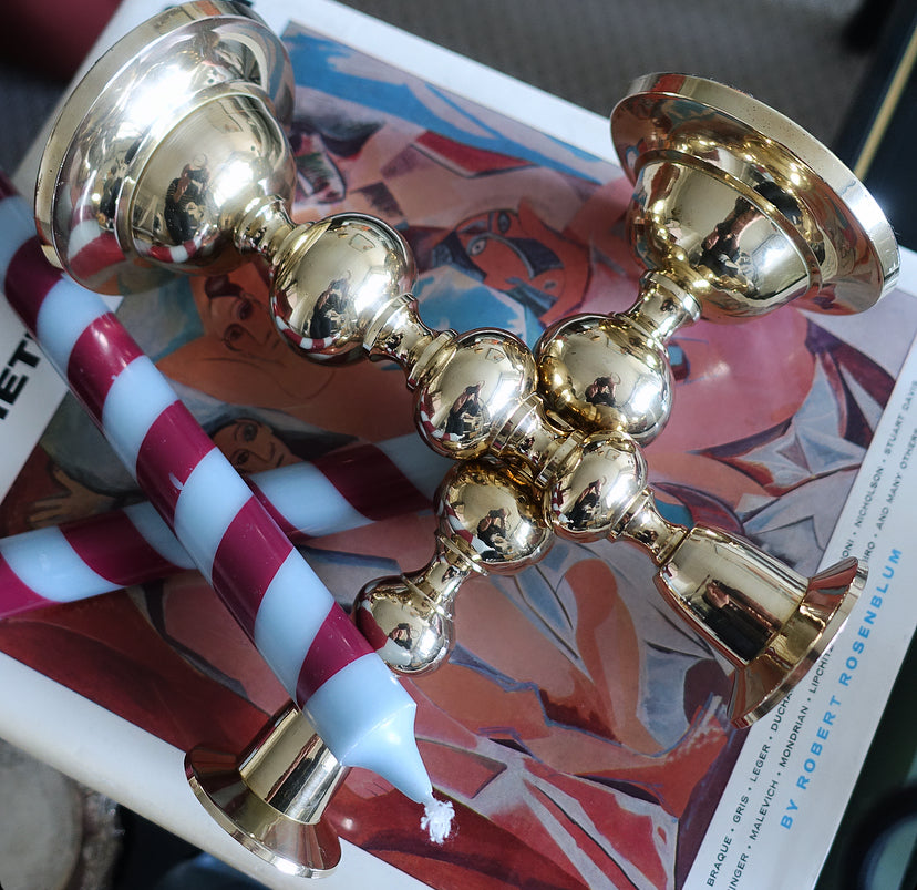 Pair of brass bobbin candle holders