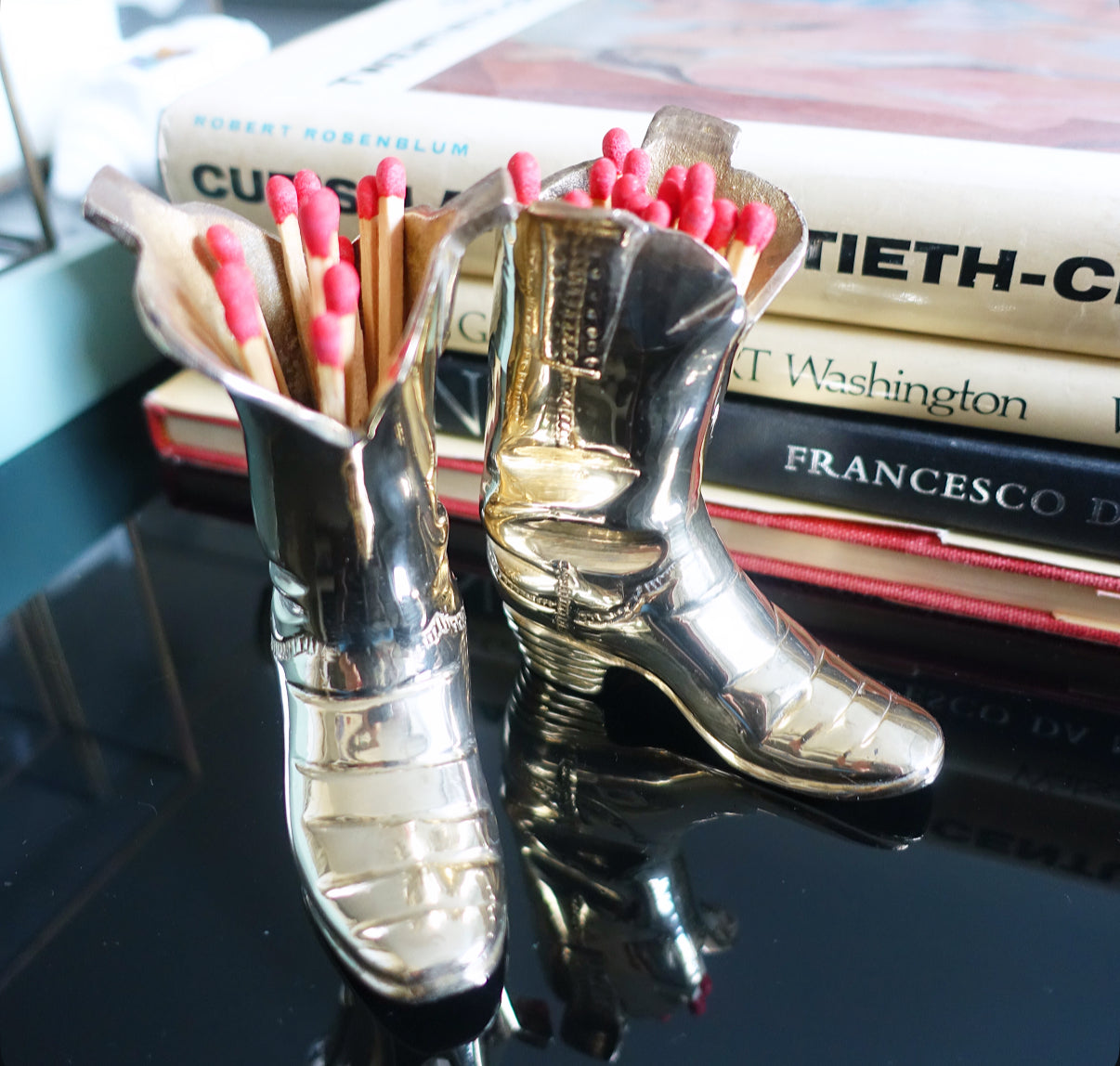 Miniature brass cowboy boots
