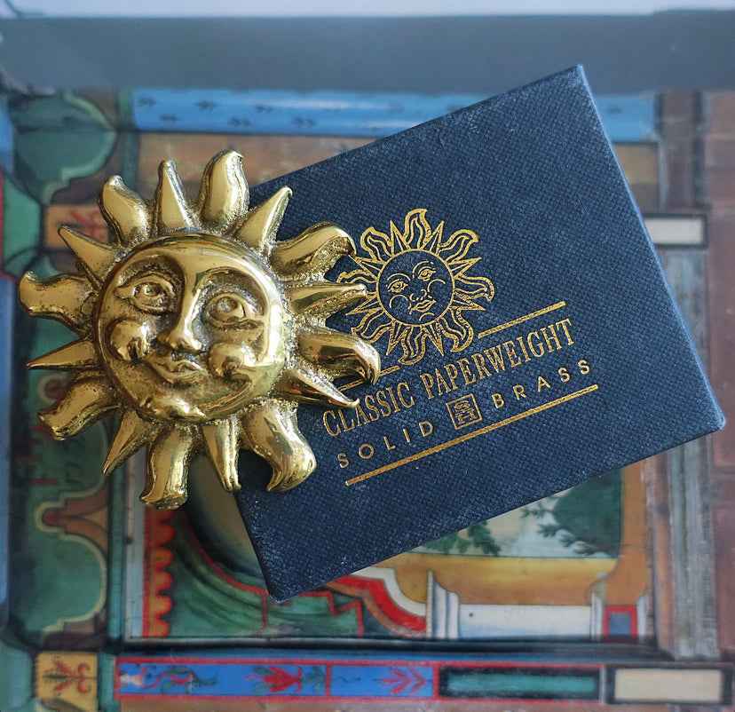 Vintage brass sun paperweight