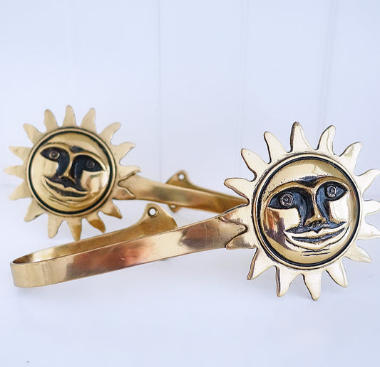 Pair of brass sun curtain tie-backs