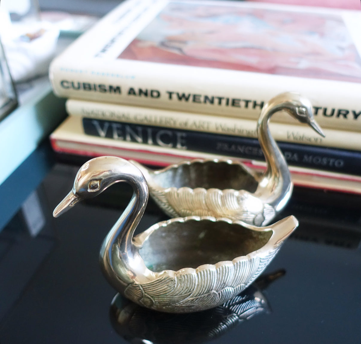 Pair of small brass swans