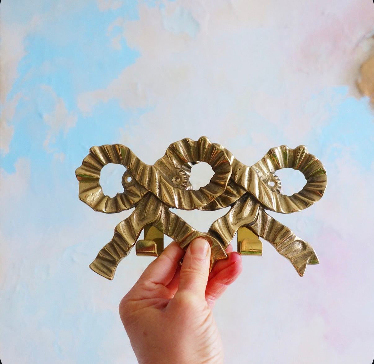 Brass bow wall hooks