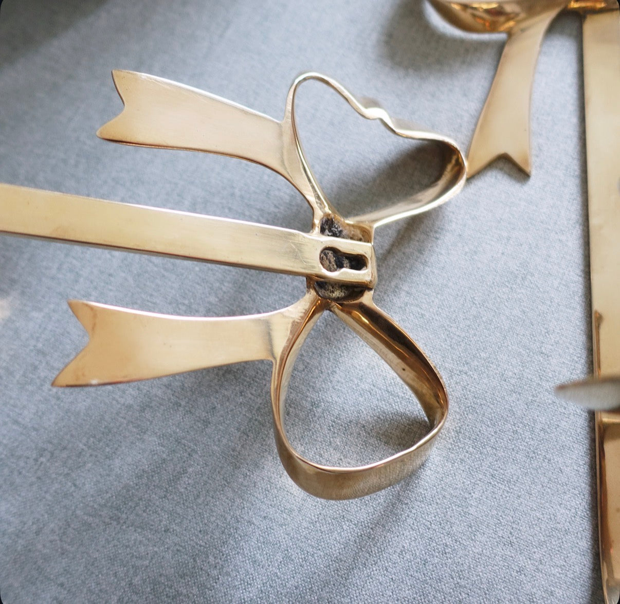 Brass bow candle sconces