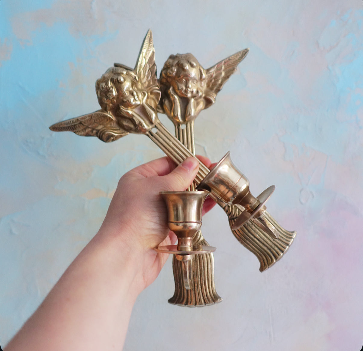 Brass cherub candle sconces