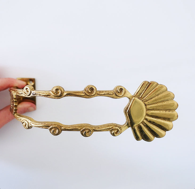 Pair of brass shell curtain tie-backs