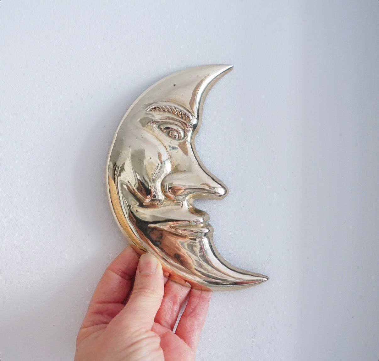 Brass sun & moon wall plaque set