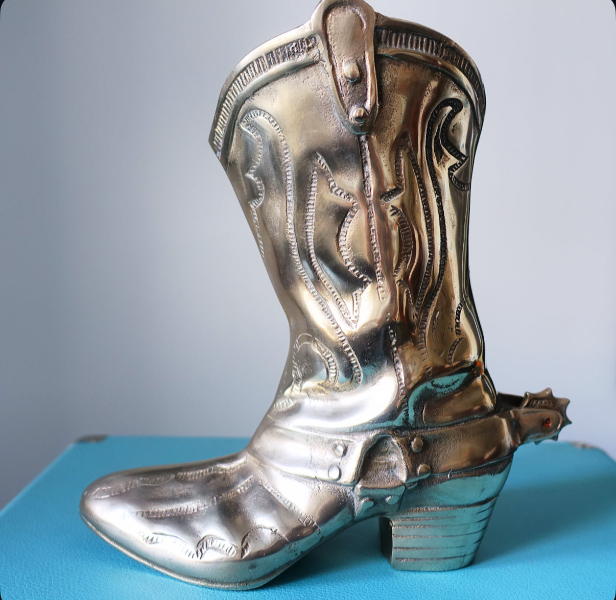 Large brass cowboy boot