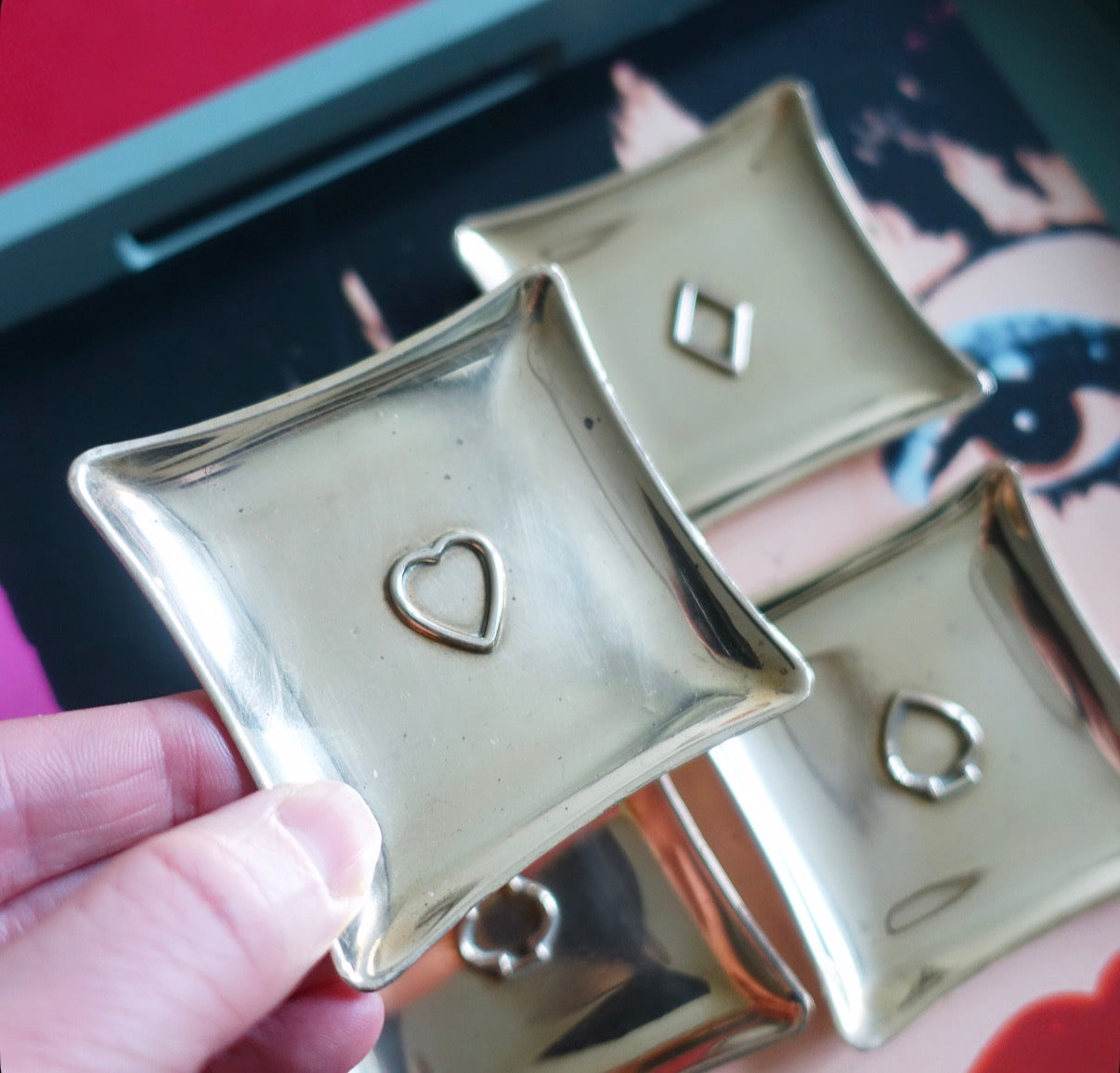 Set of four brass card suit trinket dishes