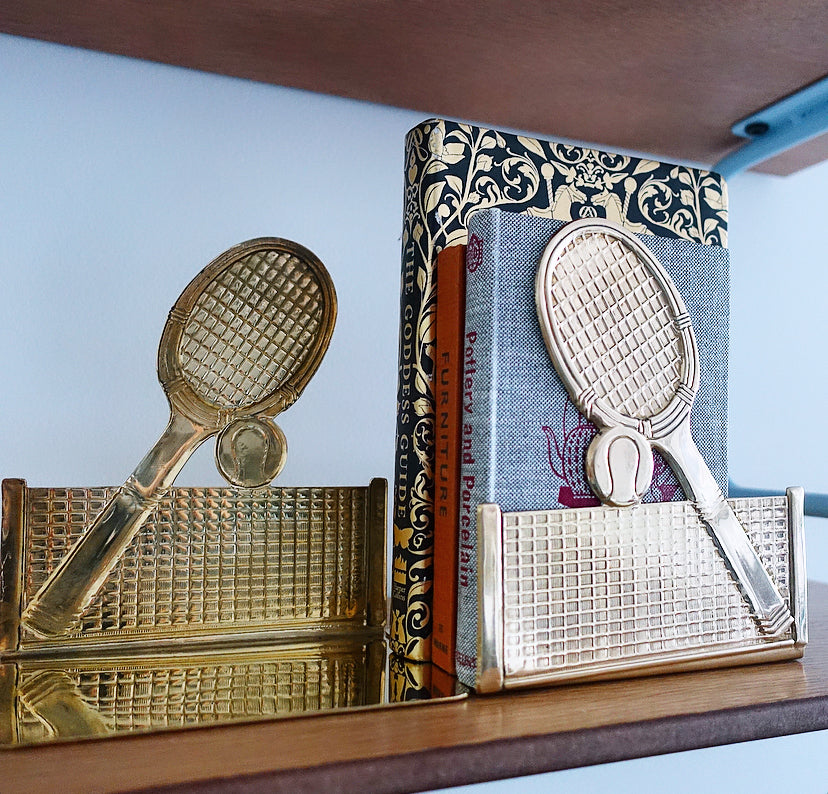 Pair of brass tennis racket, ball & net bookends