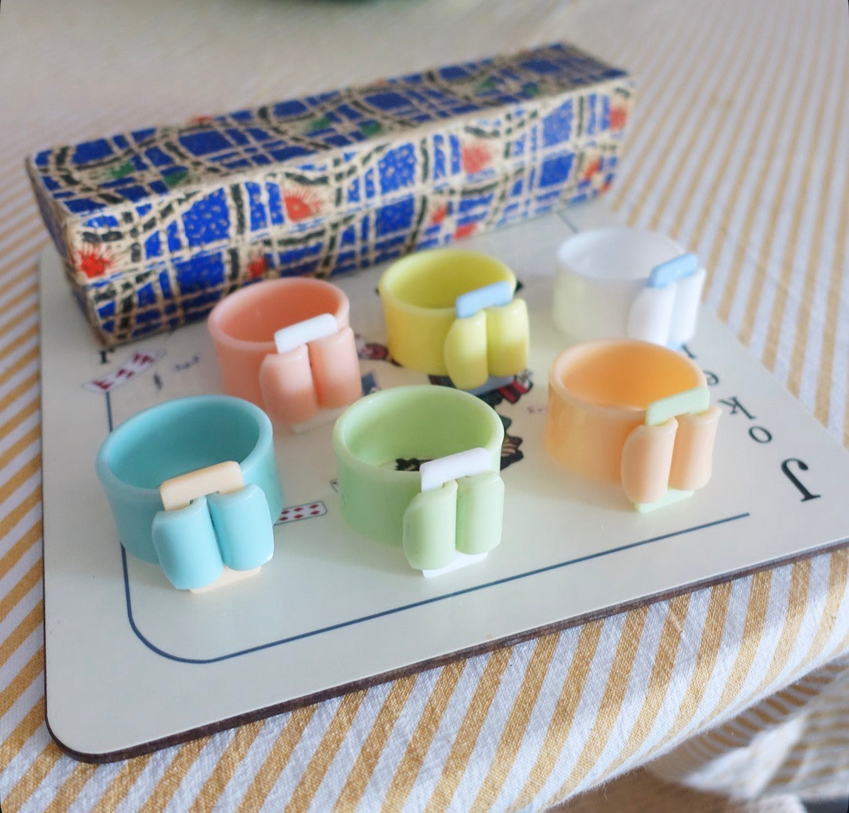 Set of six Pastel Bakelite buckle napkin rings
