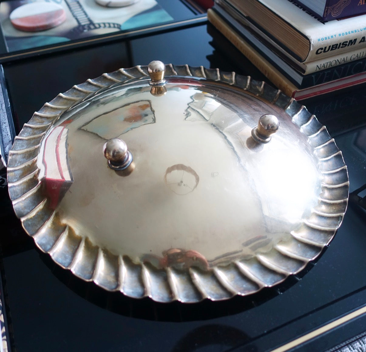 Large decorative brass bowl with ball feet
