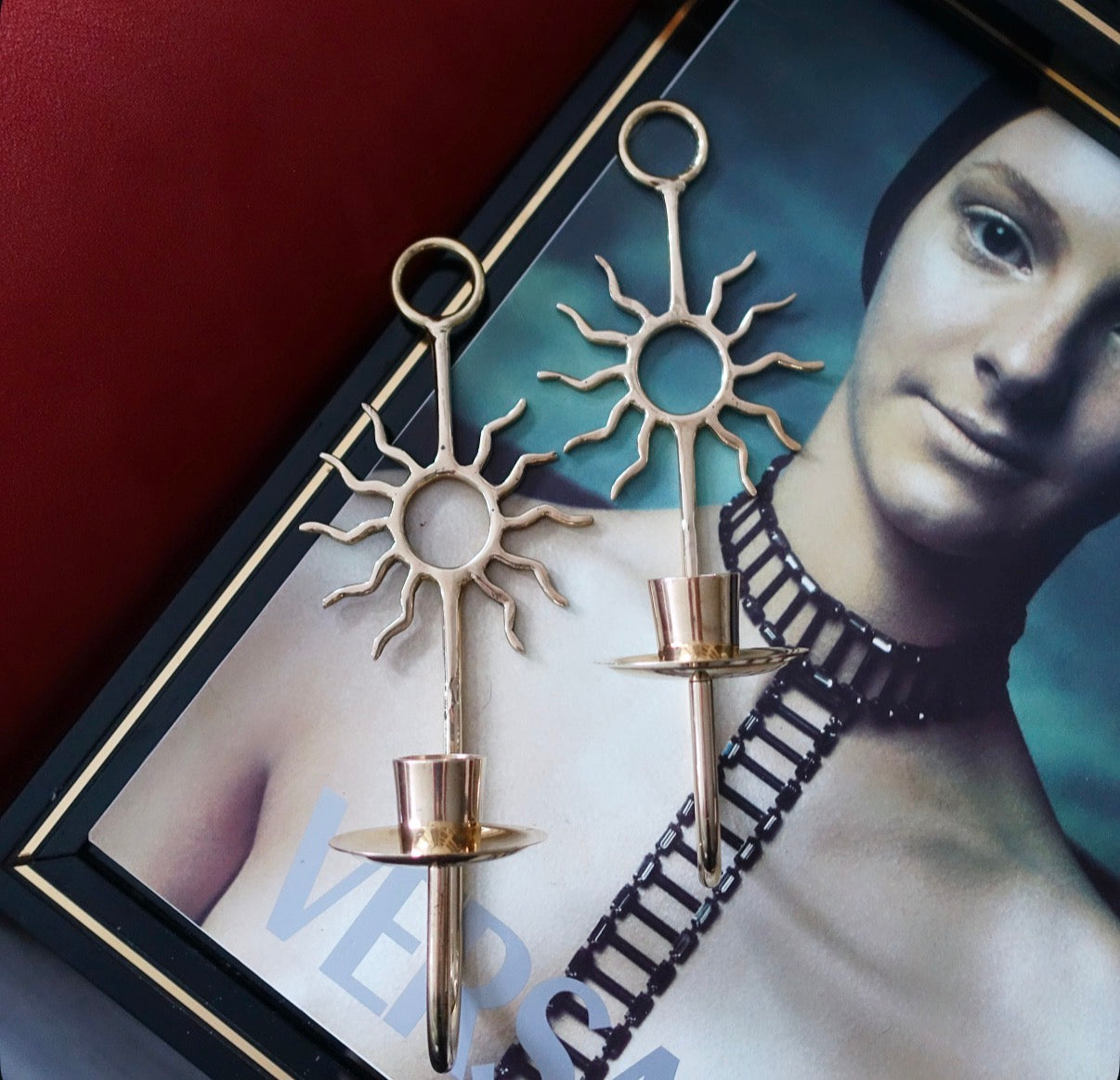 Pair of celestial brass sun candle sconces