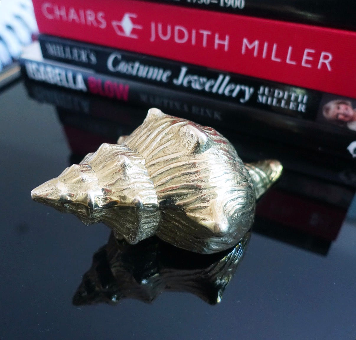 Brass conch shell paperweight