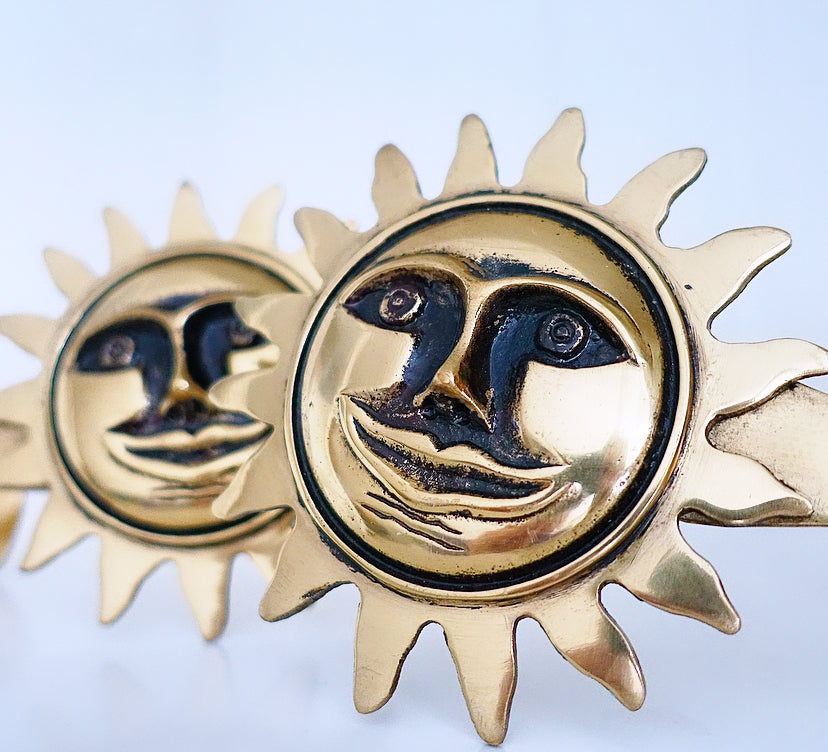 Pair of brass sun curtain tie-backs