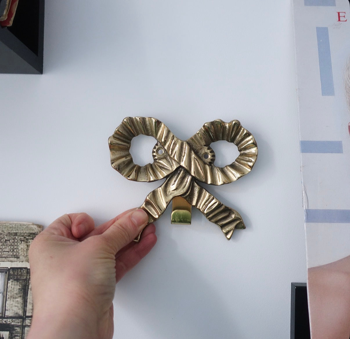 Brass bow wall hooks