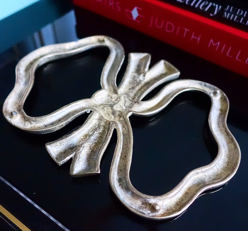 Large brass bow trivet