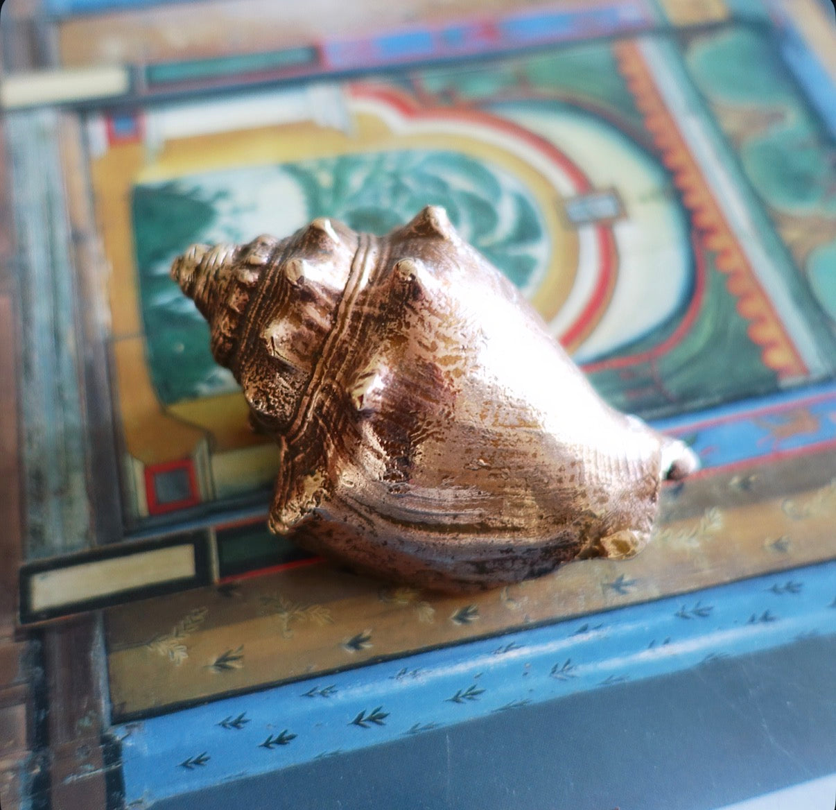 Brass conch shell paperweight