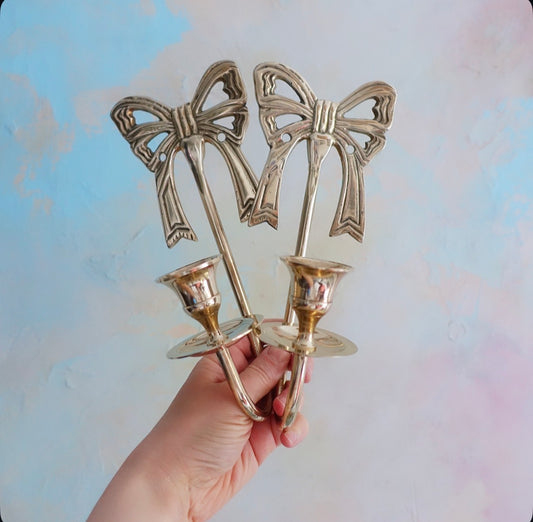 Pair of brass bow candle sconces