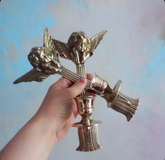 Pair of brass cherub candle sconces