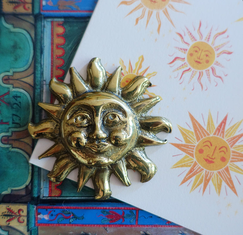 Vintage brass sun paperweight