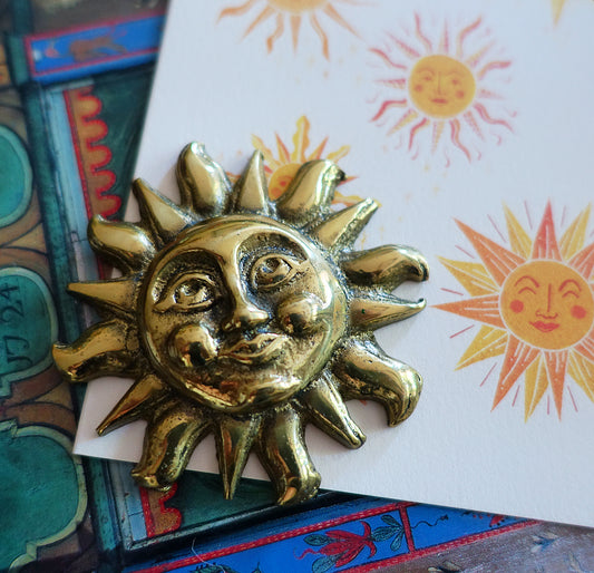 Vintage brass sun paperweight