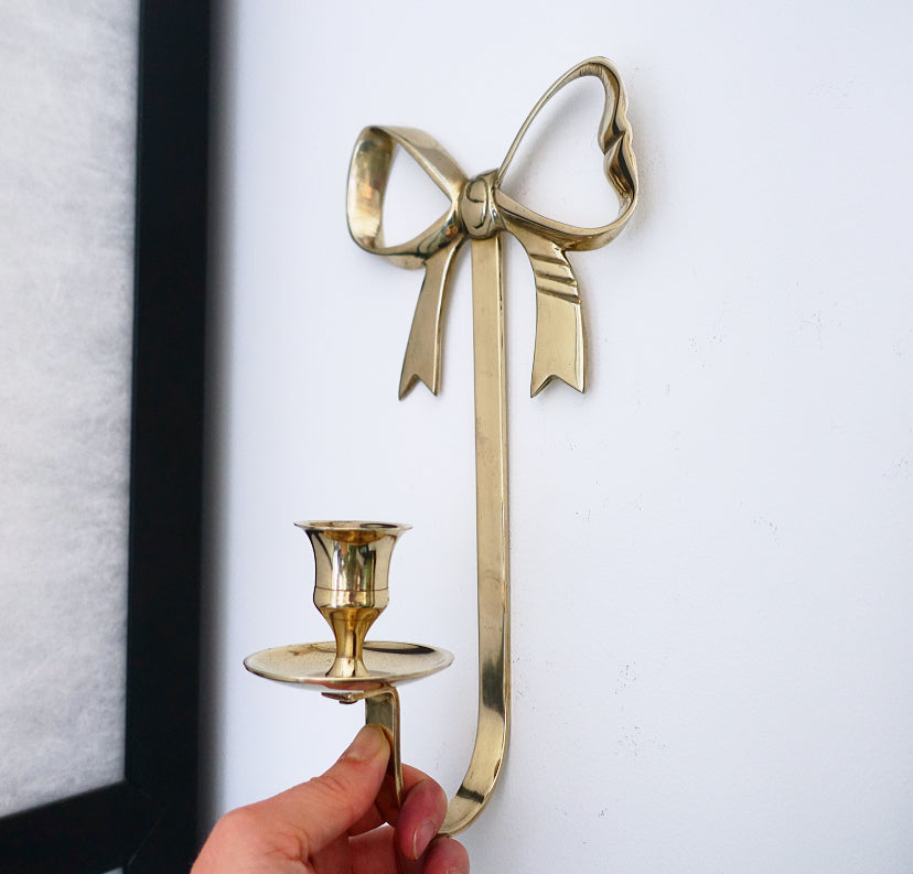 Pair of brass bow candle sconces