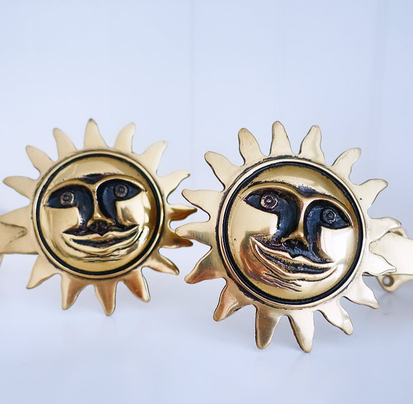 Pair of brass sun curtain tie-backs