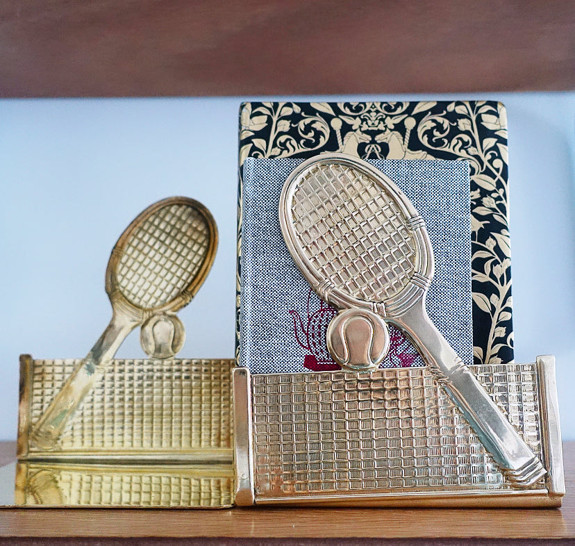 Pair of brass tennis racket, ball & net bookends