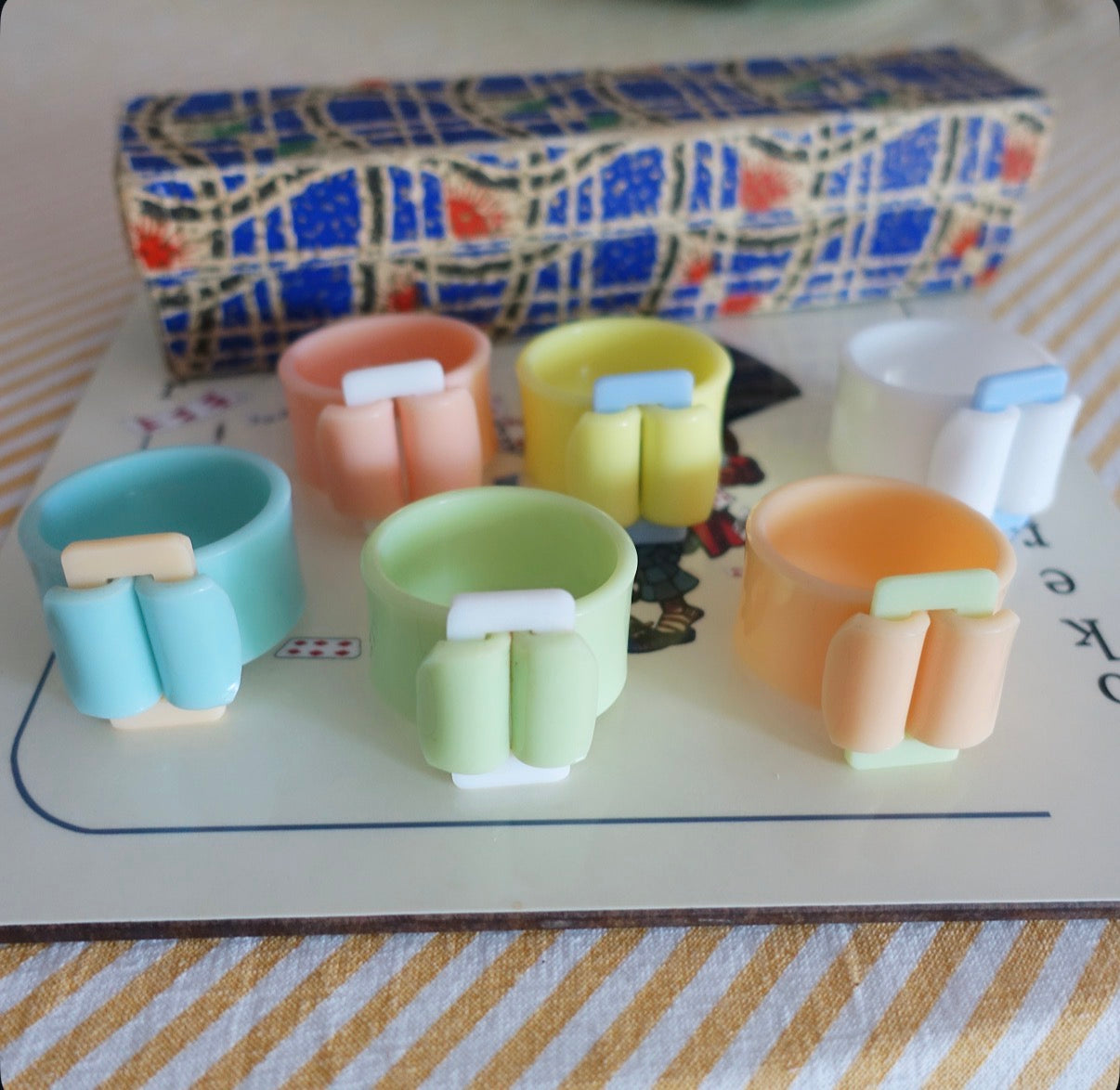 Set of six Pastel Bakelite buckle napkin rings