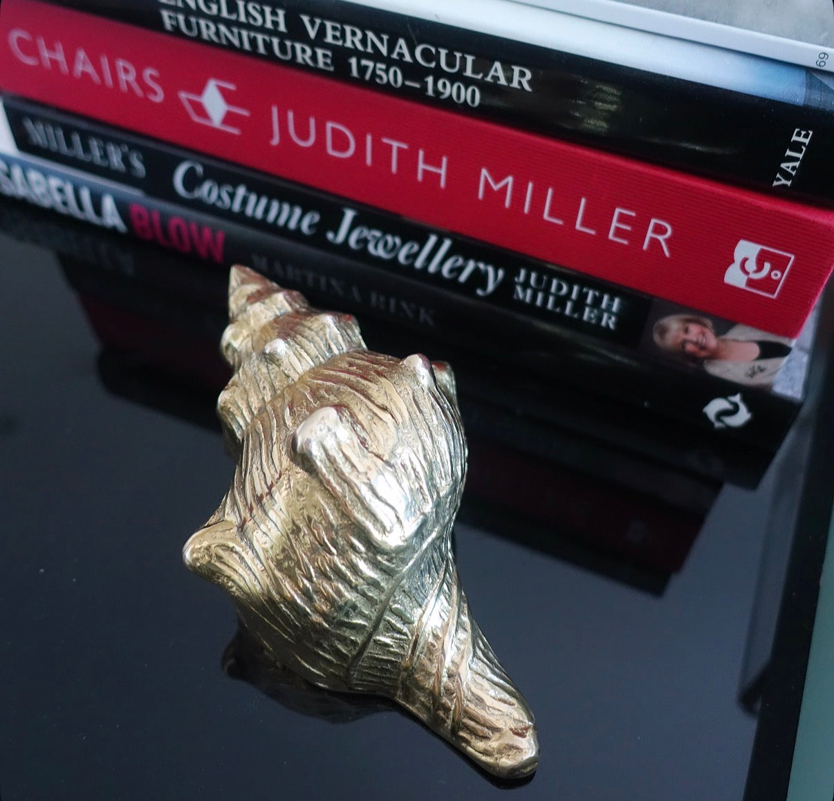 Brass conch shell paperweight