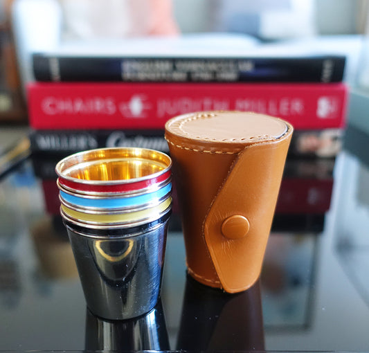 Set of four shot cups in case
