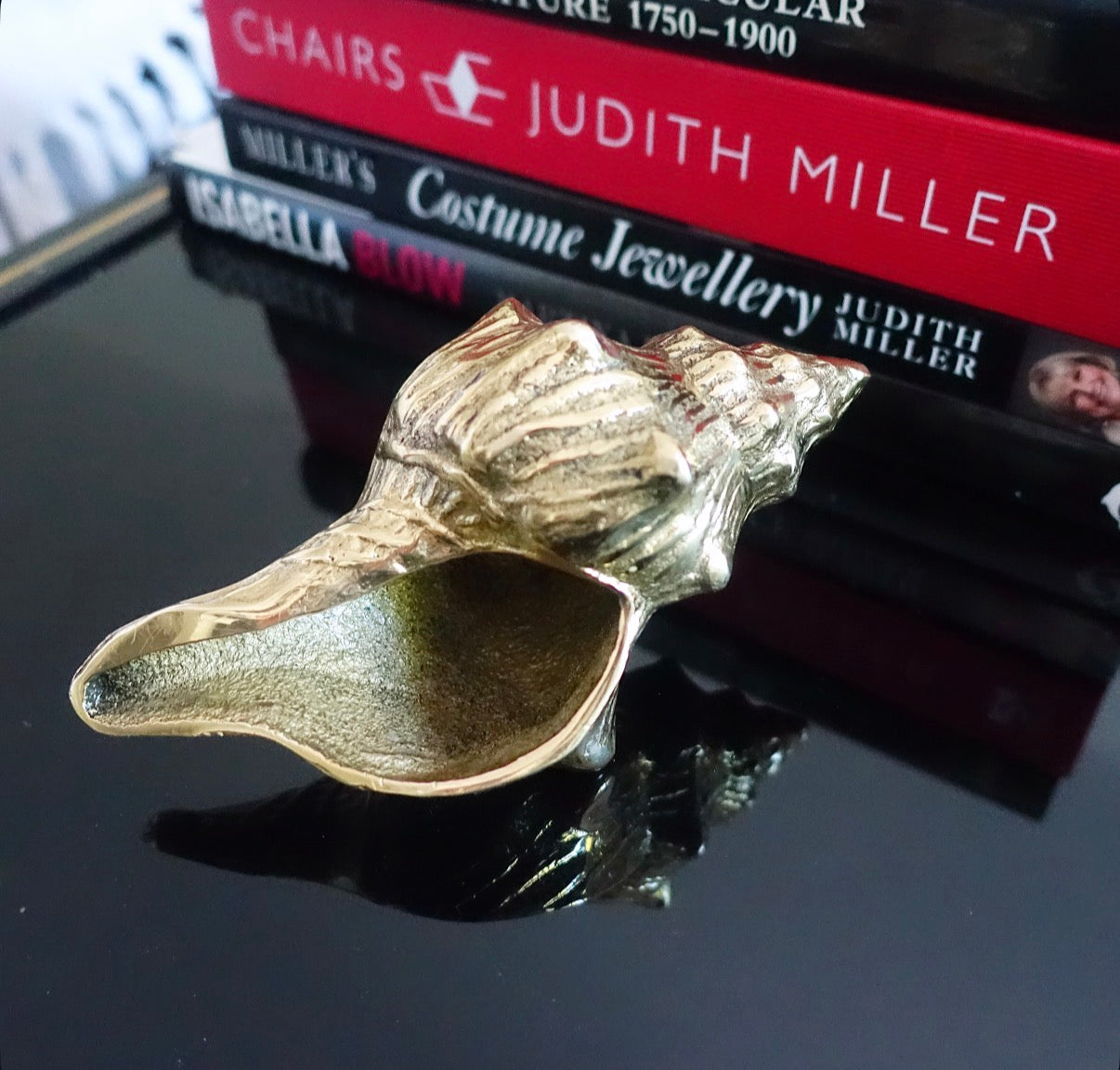 Brass conch shell paperweight