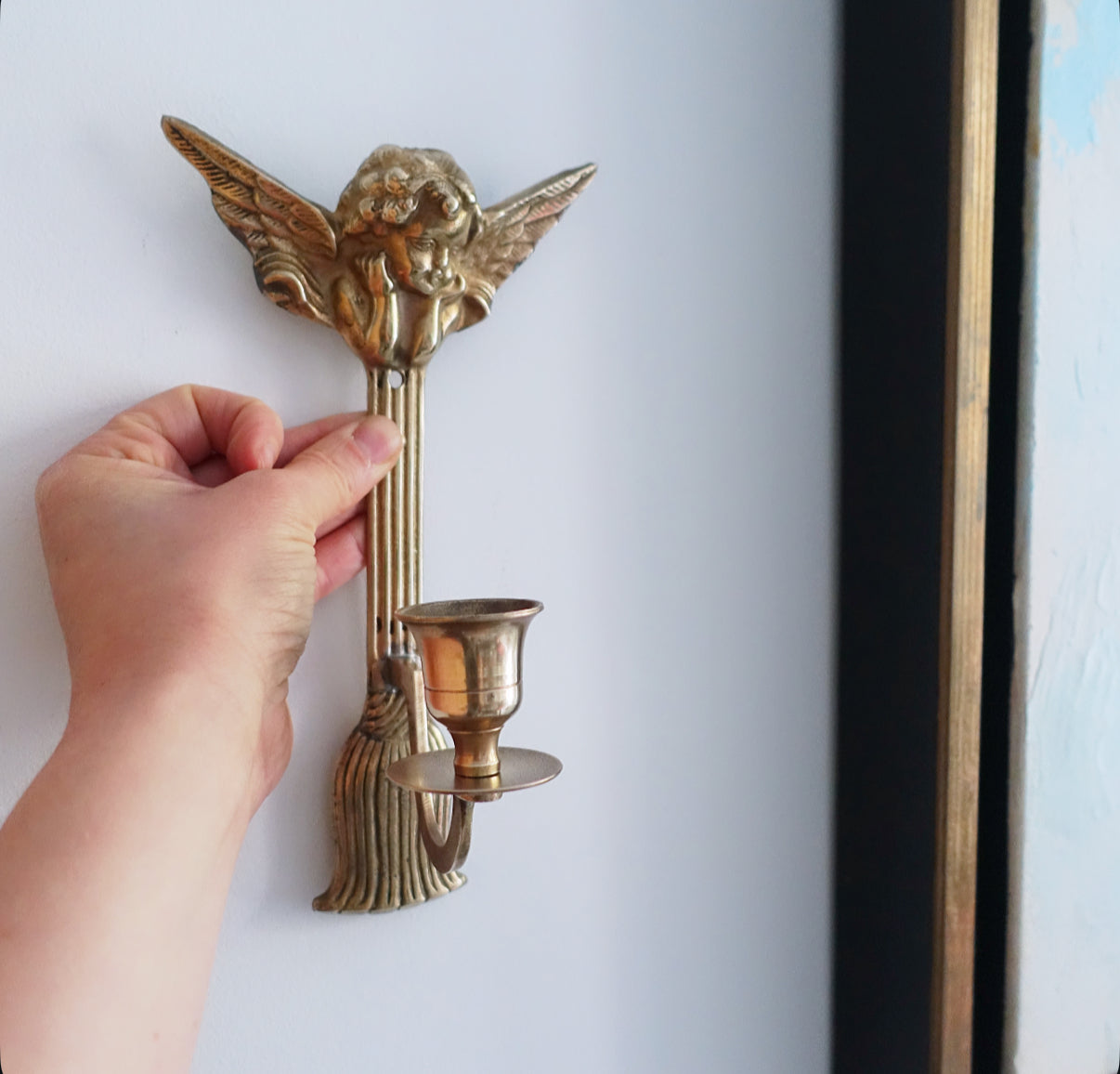 Brass cherub candle sconces