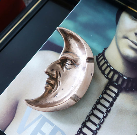 Brass man in the moon ashtray