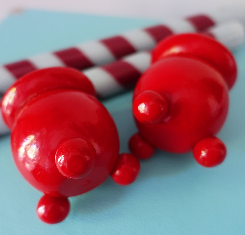 Pair of Swedish folk art candle holders