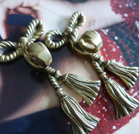 Pair of brass bow hooks