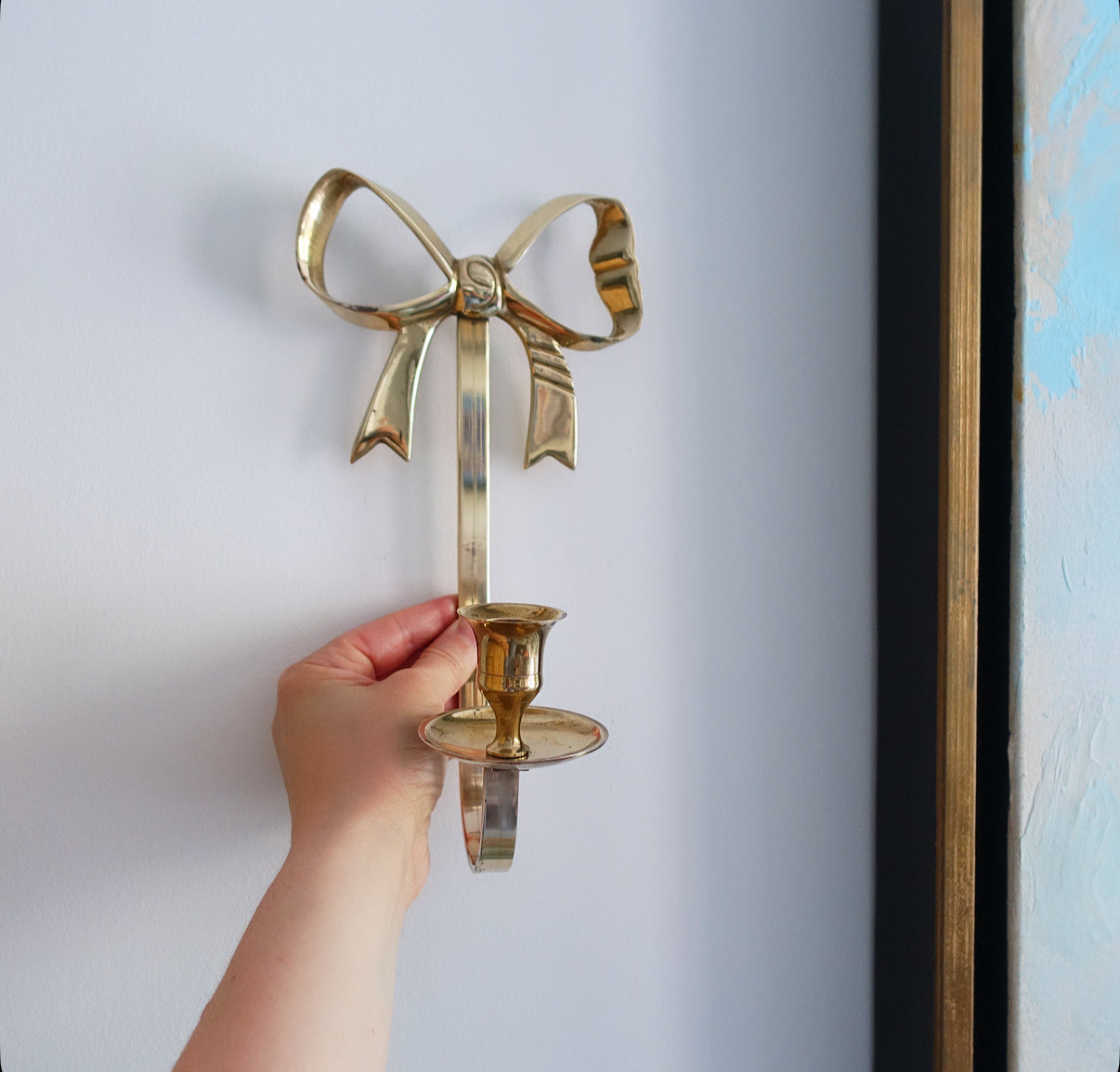 Pair of brass bow candle sconces