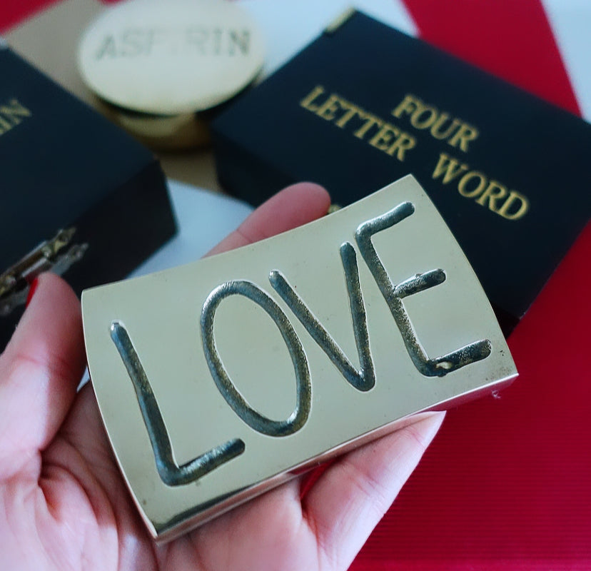 Brass love paperweight