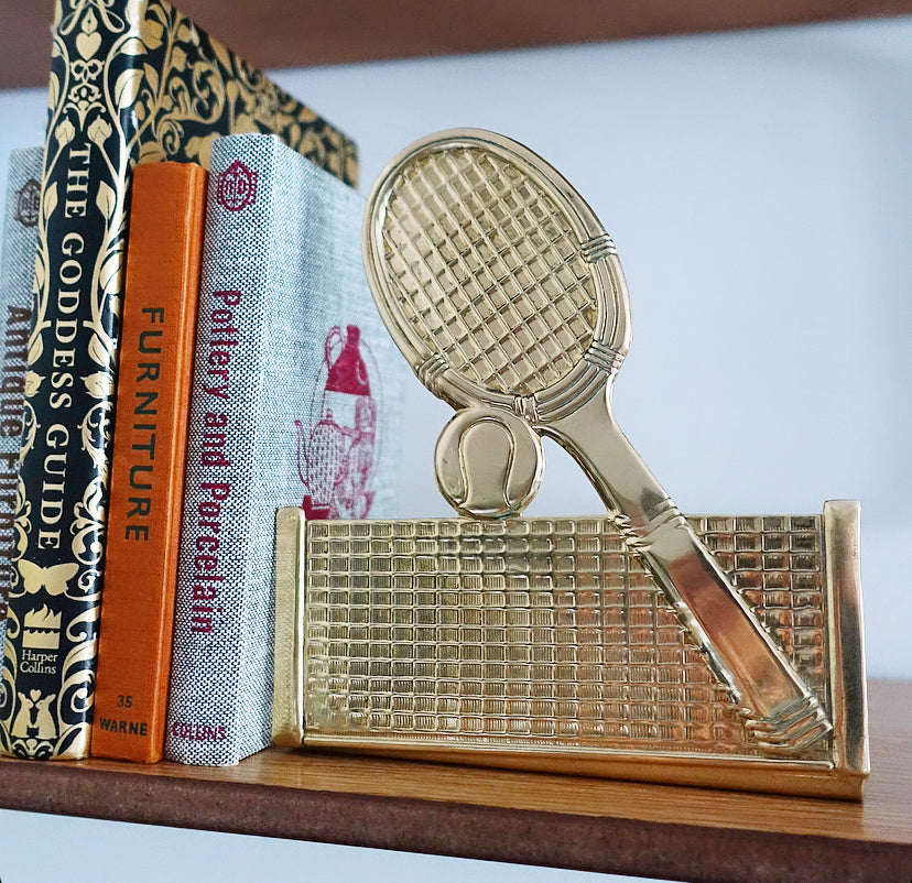 Pair of brass tennis racket, ball & net bookends