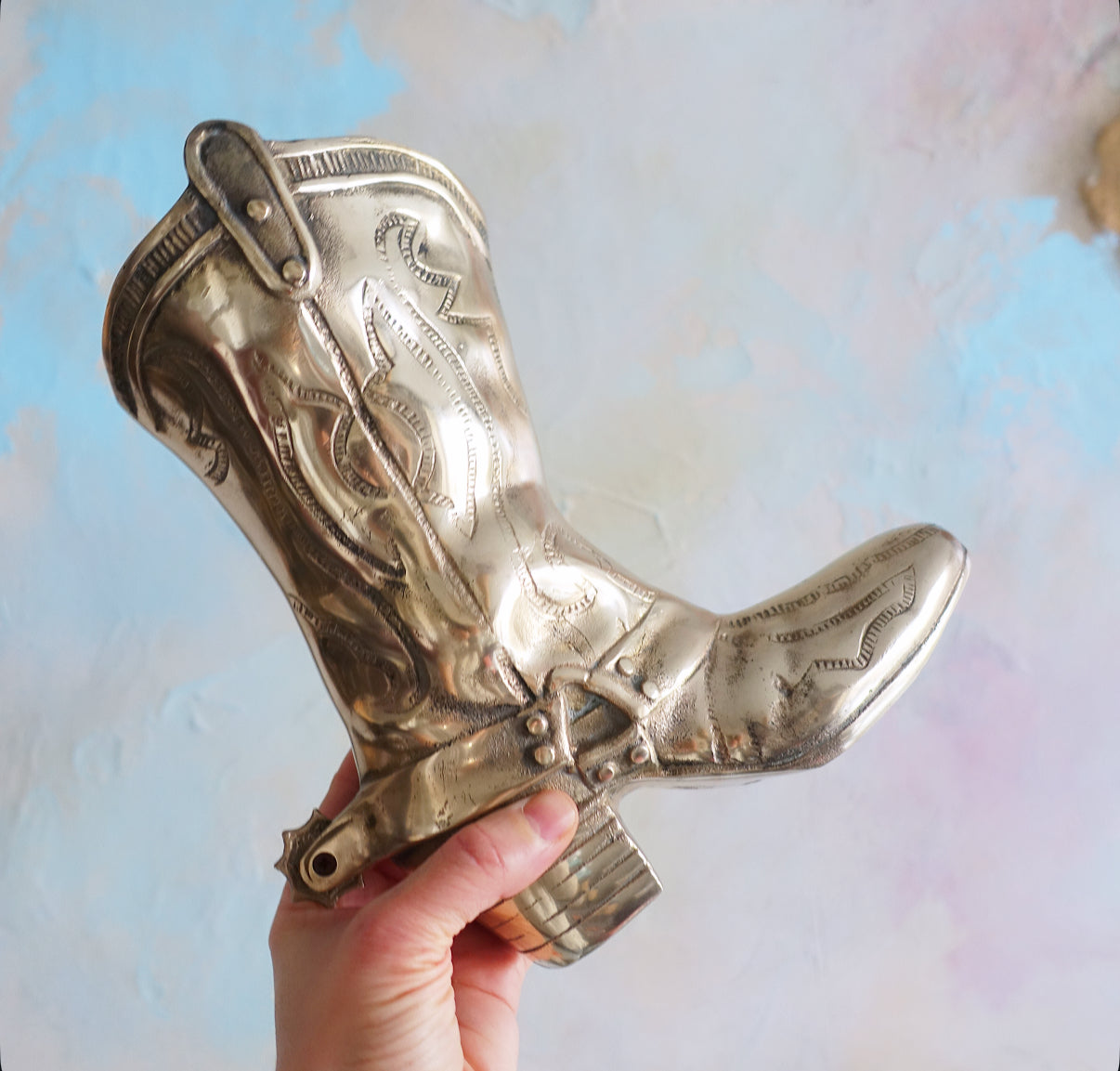 Large brass cowboy boot