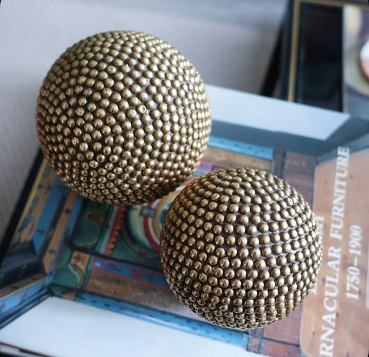 Set of five decorative brass studded balls