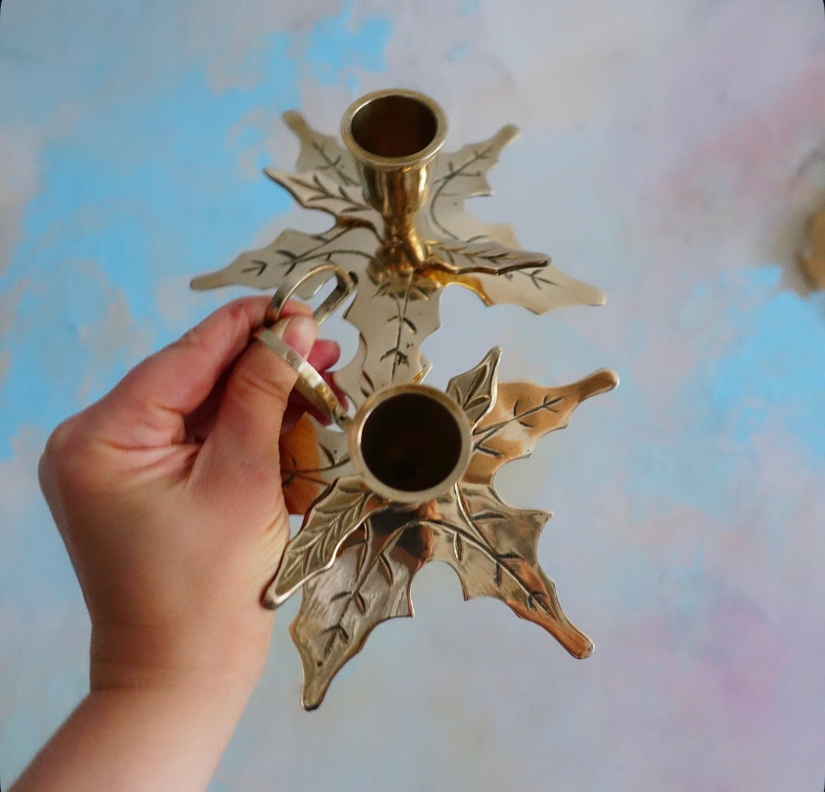 Pair of brass Holly candle holders